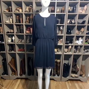 Dark blue mini dress with key-whole on front and cinched in waist.